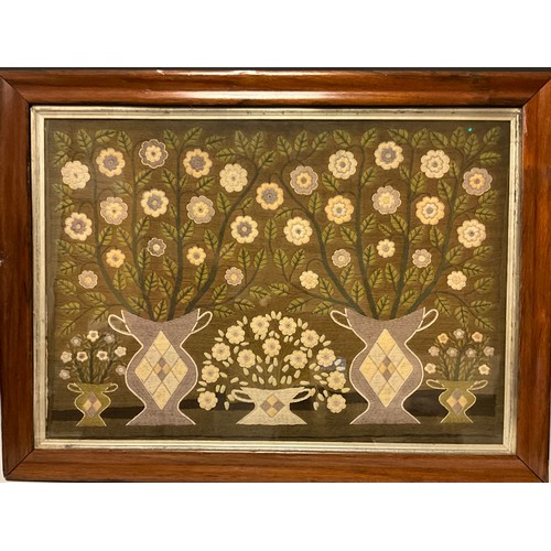 1128 - A 19th century wool work panel, depicting five vases of flowers, two pairs and central singular vase... 