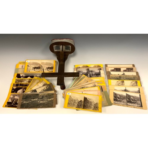 1102 - A Victorian hand held stereoscope viewer and collection of approx 80 assorted cards, including Matlo... 