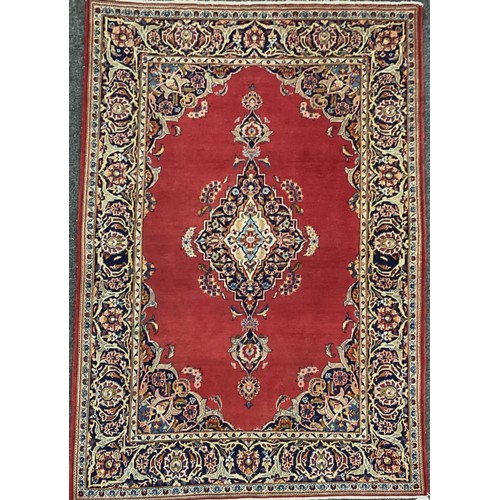 1081 - A Central Persian Kashan carpet, hand-knotted with an intricate diamond-shaped medallion to centre, ... 