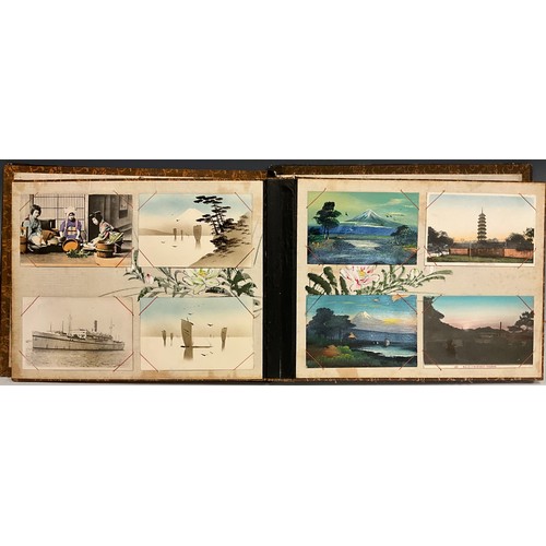 1084 - An early 20th century shibayama postcard album, the cover  applied in relief with mother-of-pearl an... 