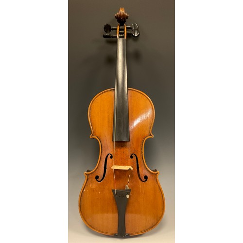 1074 - A late 19th / early 20th century violin, after Antonio Stradivari, having a well-figured two-piece b... 