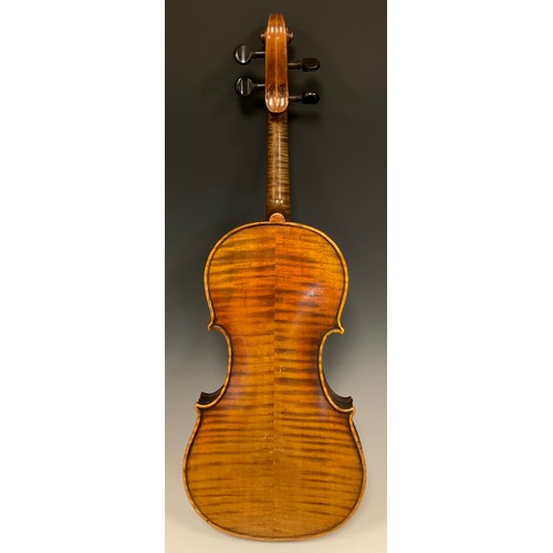 1074 - A late 19th / early 20th century violin, after Antonio Stradivari, having a well-figured two-piece b... 