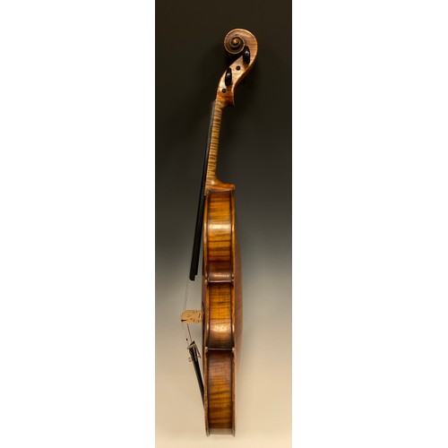 1074 - A late 19th / early 20th century violin, after Antonio Stradivari, having a well-figured two-piece b... 