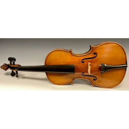 1074 - A late 19th / early 20th century violin, after Antonio Stradivari, having a well-figured two-piece b... 