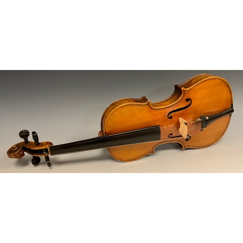 1074 - A late 19th / early 20th century violin, after Antonio Stradivari, having a well-figured two-piece b... 