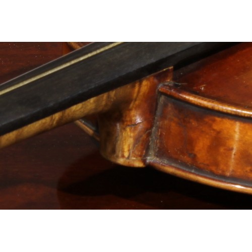 1077 - A violin, the two-piece maple back 35.5cm long excluding button, paper label printed Copy of Gio Pao... 