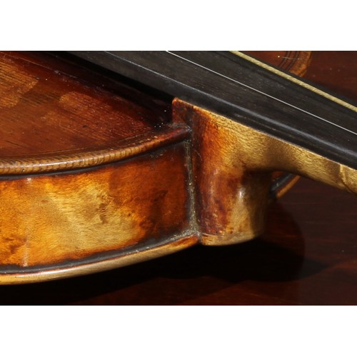 1077 - A violin, the two-piece maple back 35.5cm long excluding button, paper label printed Copy of Gio Pao... 