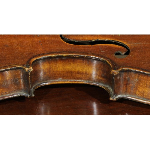 1076 - A violin, the two-piece back 36cm long excluding button, rosewood tuning pegs, outlined throughout w... 