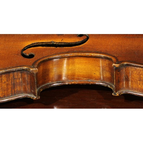 1076 - A violin, the two-piece back 36cm long excluding button, rosewood tuning pegs, outlined throughout w... 