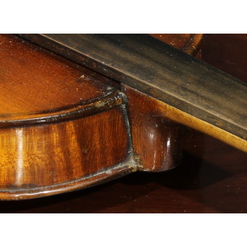 1076 - A violin, the two-piece back 36cm long excluding button, rosewood tuning pegs, outlined throughout w... 