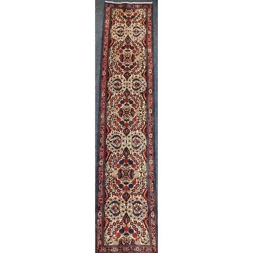 1095 - A North-west Persian Rudbar runner carpet, hand-knotted, 380cm x 72cm.