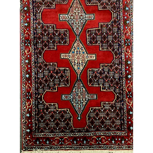 1096 - A North-west Persian Senneh ruuner carpet, hand-knotted, 405cm x 93cm.