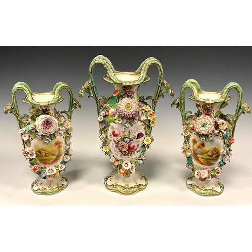 328 - A mid 19th century English porcelain three piece vase garniture, each of twin handled baluster shape... 