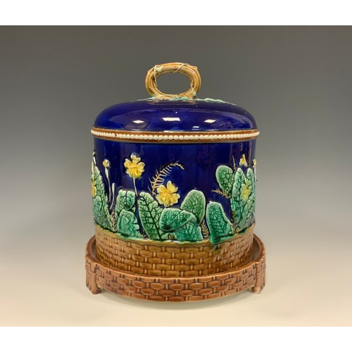 333 - A Wedgwood majolica Primrose cheese dome, moulded yellow primroses, basket weave border on cobalt bl... 