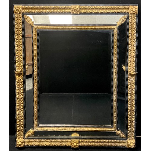 1049 - A large Baroque parcel-gilt and ebonised looking glass, bevelled mirror plate, stiff leaf border wit... 