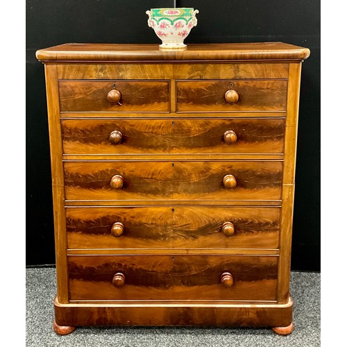 1280 - A Victorian mahogany tall chest of two short above four graduated long drawers with turned mahogany ... 