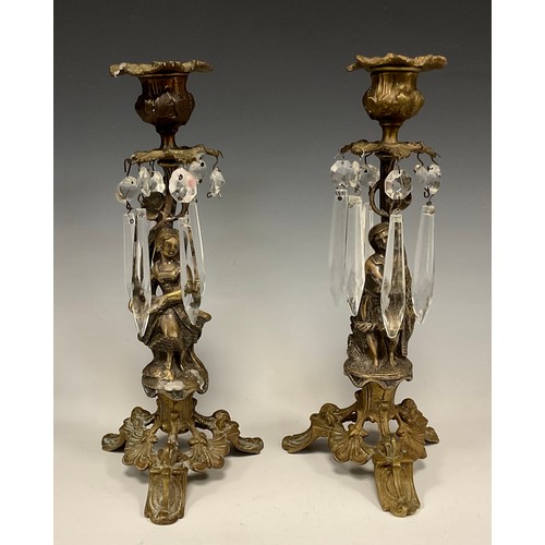 1232 - A pair of 19th century gilt bronze figural candle lustres, cast as fisher women, one holding nets, t... 