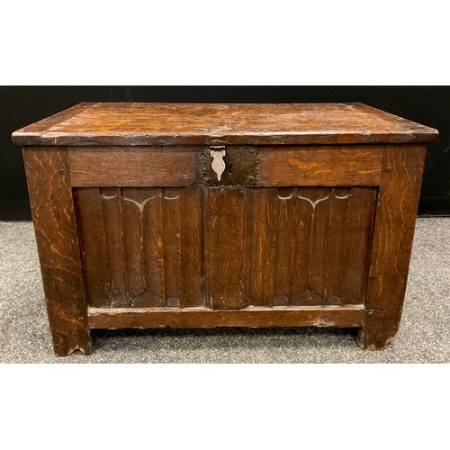 1282 - An early 17th century oak blanket chest or coffer of small proportions, two linen-fold carved panels... 