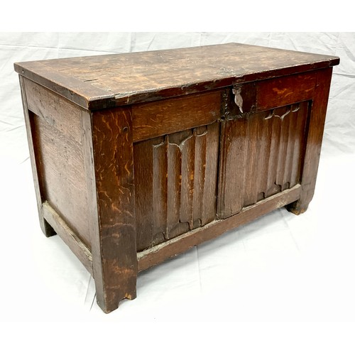 1282 - An early 17th century oak blanket chest or coffer of small proportions, two linen-fold carved panels... 