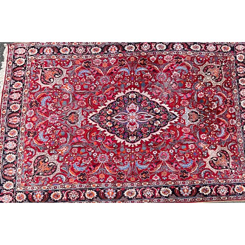 1285 - A Persian Kirman carpet, all over floral garden design inc tones of blue, cream, pink and black, on ... 