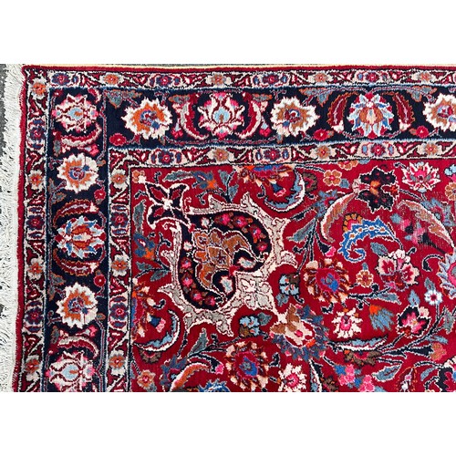 1285 - A Persian Kirman carpet, all over floral garden design inc tones of blue, cream, pink and black, on ... 