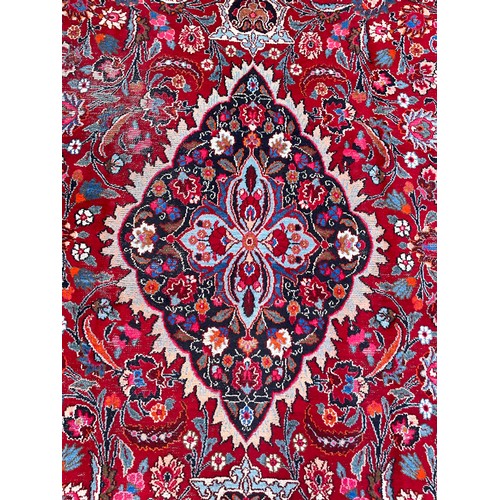 1285 - A Persian Kirman carpet, all over floral garden design inc tones of blue, cream, pink and black, on ... 