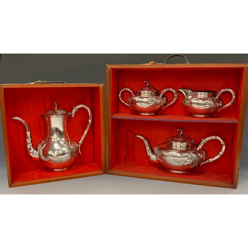 25 - A Chinese silver four piece tea and coffee service, comprising teapot, coffee pot, milk jug and sucr... 