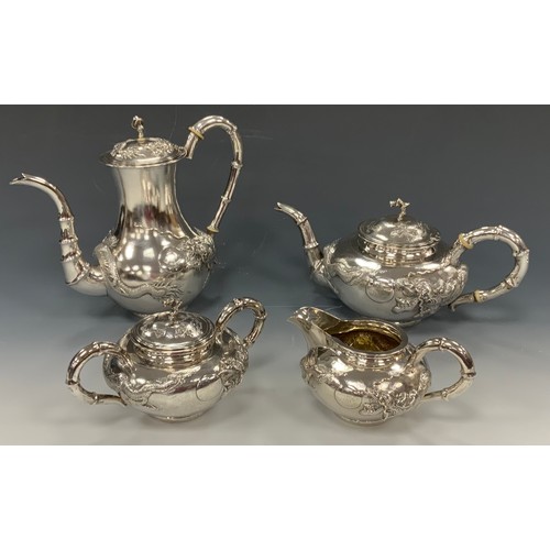 25 - A Chinese silver four piece tea and coffee service, comprising teapot, coffee pot, milk jug and sucr... 