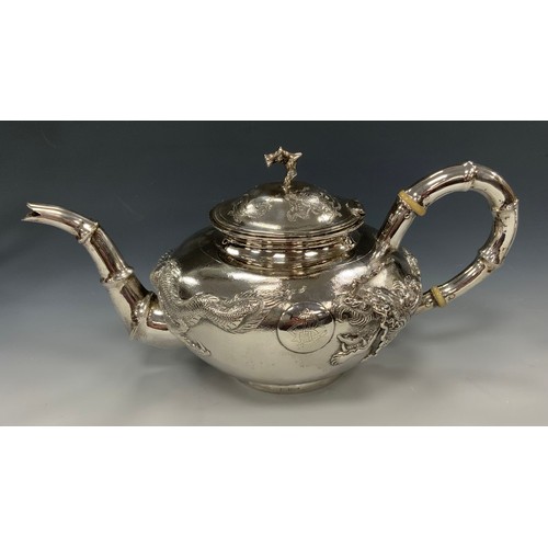 25 - A Chinese silver four piece tea and coffee service, comprising teapot, coffee pot, milk jug and sucr... 