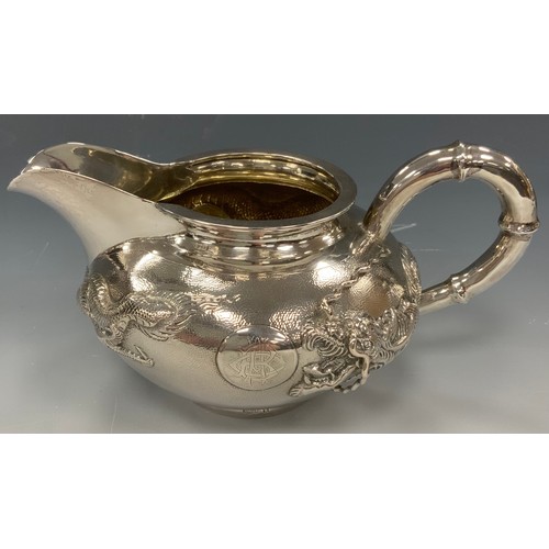 25 - A Chinese silver four piece tea and coffee service, comprising teapot, coffee pot, milk jug and sucr... 