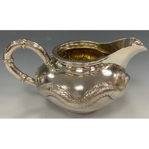 25 - A Chinese silver four piece tea and coffee service, comprising teapot, coffee pot, milk jug and sucr... 