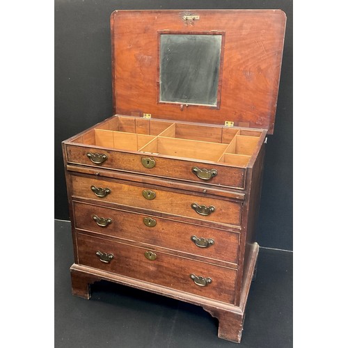 1276 - A George III mahogany bachelor’s chest, the hinged top lifting to reveal a partitioned recess with m... 