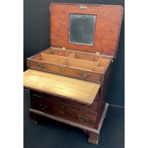 1276 - A George III mahogany bachelor’s chest, the hinged top lifting to reveal a partitioned recess with m... 