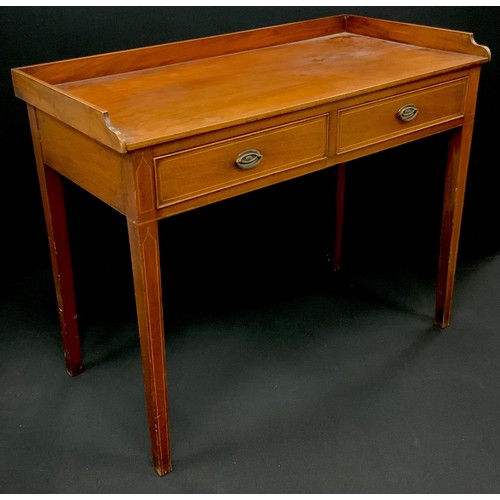 1214 - A George III revival mahogany writing desk, the three-quarter galleried top, above a pair of short d... 