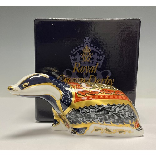 69 - A Royal Crown Derby paperweight, Moonlight Badger, gold stopper, 15cm long, printed mark in red, box... 