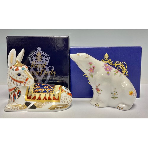 75 - A Royal Crown Derby paperweight, Donkey, gold stopper, boxed; another, Derby Posies Polar Bear, gold... 