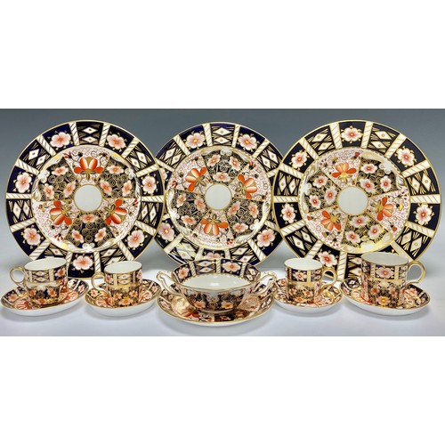 76 - An associated pair of Royal Crown Derby Imari palette 2451 pattern coffee cups and saucers; an assoc... 