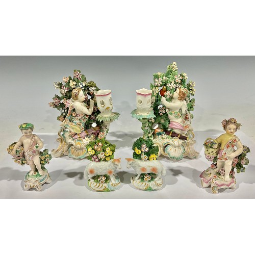 81 - A Derby porcelain figural candlestick/chamberstick, modelled as Cupid kneeling before bocage, c-scro... 