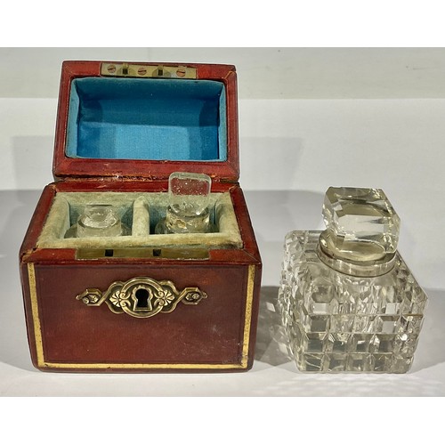 98 - A Victorian leather bound scent bottle casket, the hinged cover enclosing two facetted glass scent b... 