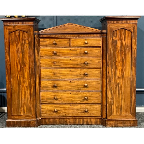 101 - A Victorian mahogany compactum wardrobe, centred by two short and six long drawers, flanked by panel... 