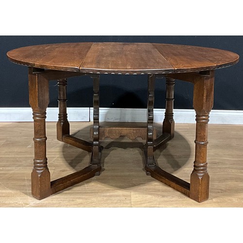 110 - An oak double-gateleg dining table, possibly Titchmarsh & Goodwin, 72cm high, 138.5cm long, 48cm ope... 