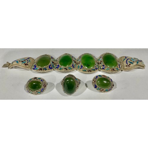 403 - A suite of Chinese silver filigree and champlevé enamel jewellery, applied with polished jade caboch... 