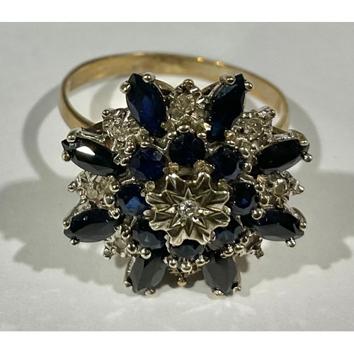 407 - An unmarked gold diamond and sapphire cluster ring, size O, 4.3g gross