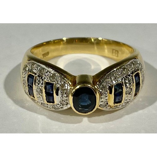 408 - An 18ct gold sapphire and diamond ring, central oval stone flanked by pair of baguette cuts either s... 