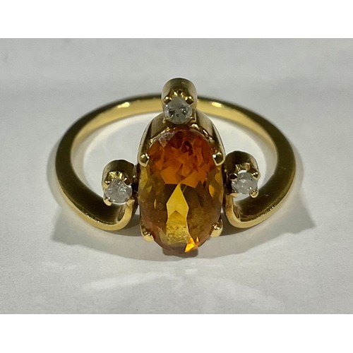 416 - An unmarked citrine and diamond ring, size M, 3.1g, probably 18ct