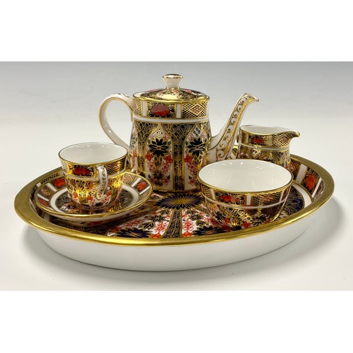 2 - Royal Crown Derby 1128 Imari pattern miniature cabaret tea set comprising teapot, teacup and saucer,... 