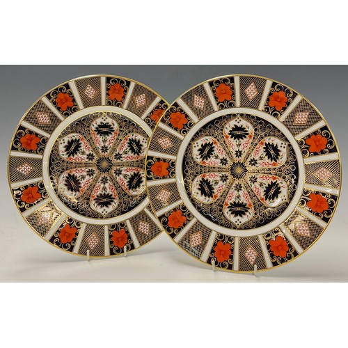 6 - A pair of Royal Crown Derby Imari palette 1128 pattern dinner plates, 27cm diameter, both first qual... 