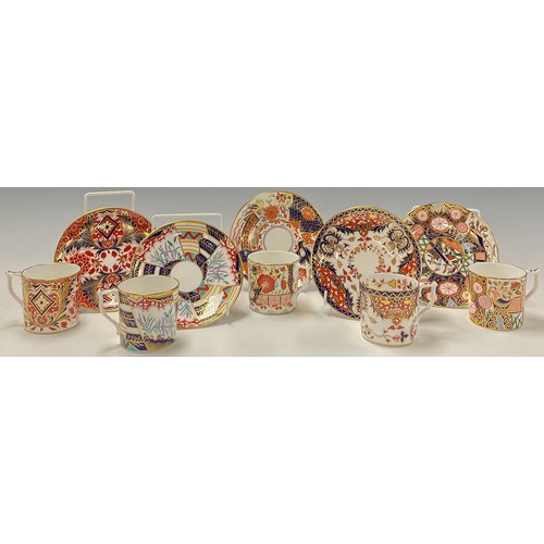 17 - A set of four Royal Crown Derby Curator's Collection coffee cans and saucers and one harlequin set, ... 