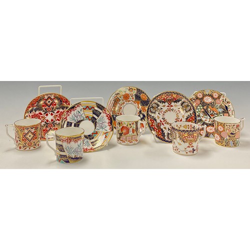 17 - A set of four Royal Crown Derby Curator's Collection coffee cans and saucers and one harlequin set, ... 