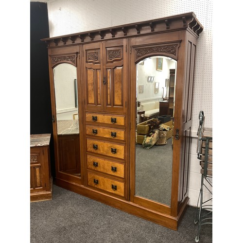 1297 - A Victorian walnut compactum wardrobe, and a matching washstand chest with three graduated long draw... 